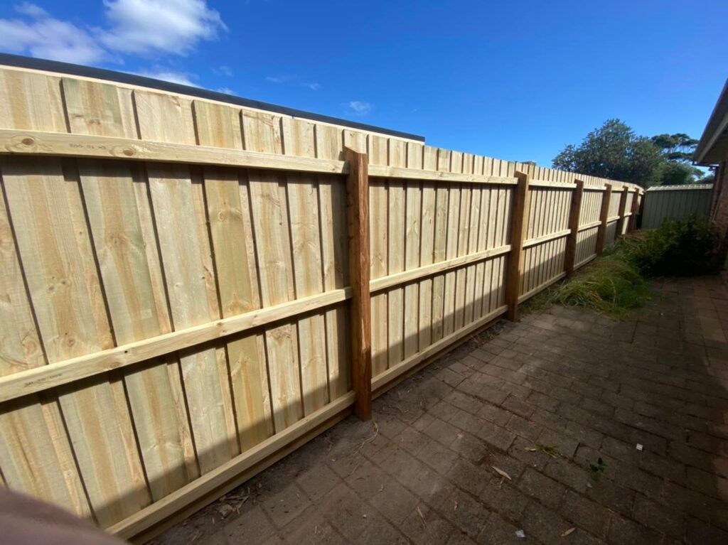 Railing side of a boundary fence, exposed posts